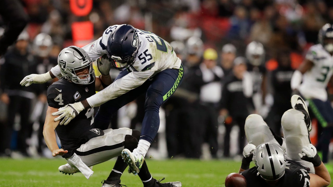 Under pressure: Sacks rise for Carr behind hurt Raiders line
